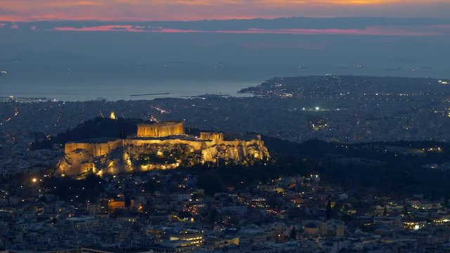 Athens, Greece. Panning shot of Parthenon and Herodium construction in Acropolis Hill in blue hour