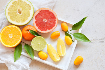 Set of citrus on light background: orange, mandarin, lemon, grapefruit, lime, kumquat, tangerine....