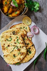 Homemade Kulcha / Indian flat bread Butter Naan served with Alu Matar
