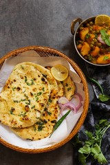 Homemade Kulcha / Indian flat bread Butter Naan served with Alu Matar
