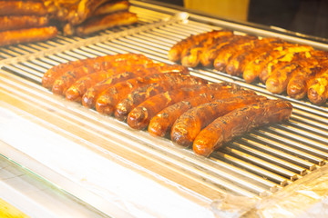 roasted sausages, traditional german food at Christmas market, retro toned
