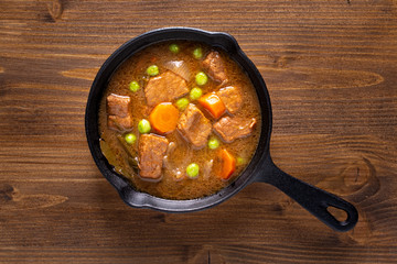 Winter Food concept homemade organic stew beef or bourguignon in Cast-Iron Skillet pan with copy space