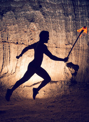 Man running with torch