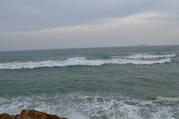 Sea rocks sand waves