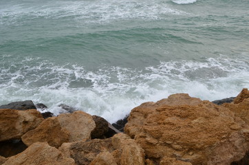 Sea rocks sand waves