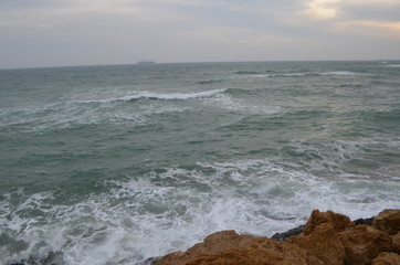 Sea rocks sand waves