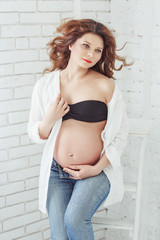Portrait of a happy young beautiful pregnant woman