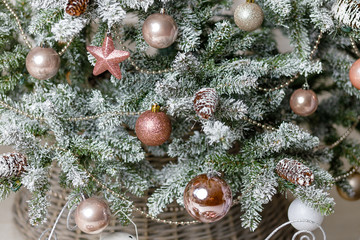 Christmas or New Year background: lamp, pink glass balls and toys, powder decoration, wool blanket