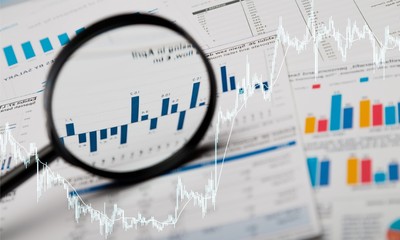 Magnifying glass and business growth graph ,business concept.