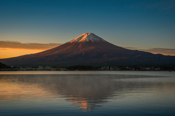 Mt. Fuji over Lake Kawaguchiko at sunrise in Fujikawaguchiko, Japan.