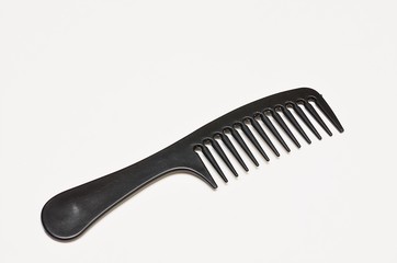 Black comb on white background