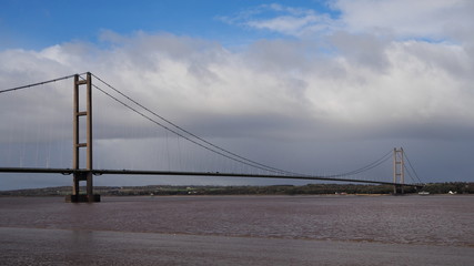 Humber Bridge, a single span suspension bridge spanning the River Humber, viewed from Barton-on-Humber, Lincolnshire looking back towards Hessle, Yorkshire, UK