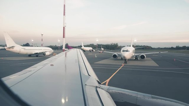 Airplain Moving at the Airport. Passengers POV through Window
