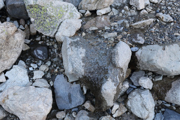 The sign of a dug surface due to water and ice erosion over a hard rock in Panticosa, Aragon Pyrenees, Spain