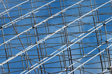Metal scaffolding against blue sky