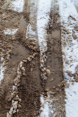 Obraz premium Traces of cars in the snow as a background