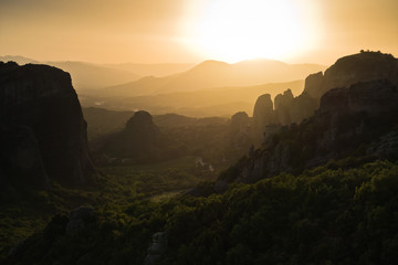 Huge rocks at sunset with Meteora valley in background, near Kalambaka, Thessaly, Greece