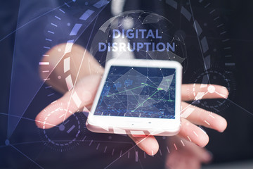 The concept of business, technology, the Internet and the network. A young entrepreneur working on a virtual screen of the future and sees the inscription: digital disruption