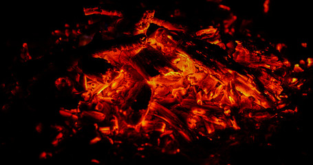 Fototapeta na wymiar Coal burning fires that sparkle again with the wind again and start burning in super slow motion capture.