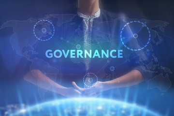 The concept of business, technology, the Internet and the network. A young entrepreneur working on a virtual screen of the future and sees the inscription: Governance