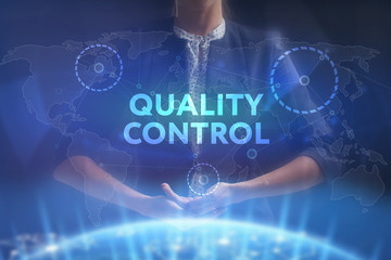 The concept of business, technology, the Internet and the network. A young entrepreneur working on a virtual screen of the future and sees the inscription: Quality control