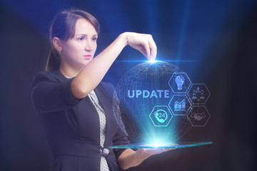 The concept of business, technology, the Internet and the network. A young entrepreneur working on a virtual screen of the future and sees the inscription: Update