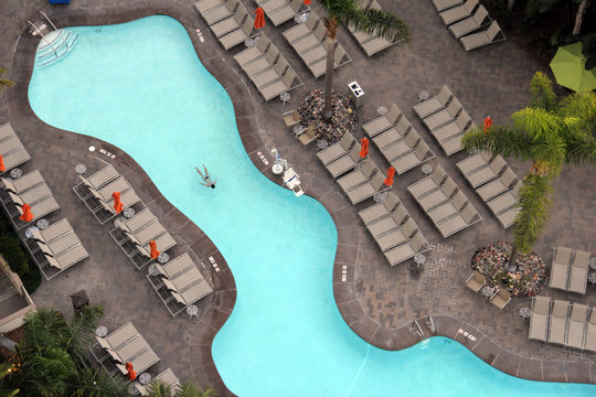 Overhead View Of A Woman Swimming In A Pool