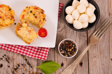 Potato gratins with mozzarella and tomatoes.