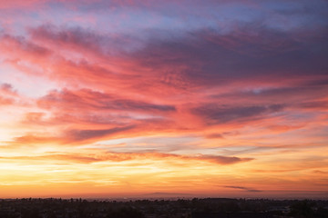 Photograph of a colorful sunset on the horizon