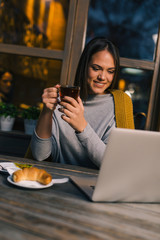 Browsing news and enjoying cup of tea
