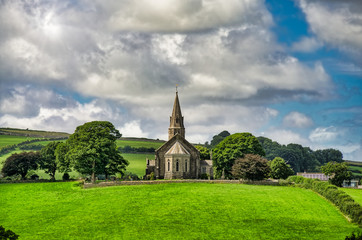 Fototapeta na wymiar A view of Holy Trinity church, Bardsea Cumbria, England.