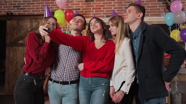 Cheerful friends taking selfie at the birthday party, good-looking young people celebrating important event