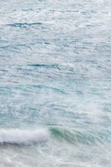 Long exposure of rocks and waves at Little Oberon bay in Wilsons Promontory national park, Victoria, Australia