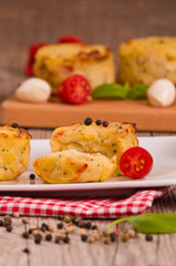 Potato gratins with mozzarella and tomatoes.
