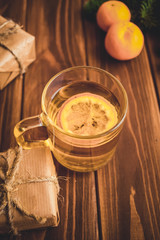 Christmas gift box, food decor and fir tree branch on wooden table. Top view with copy space
