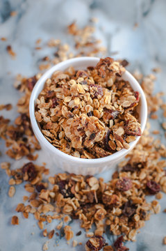 Homemade roasted granola on marble background, top view