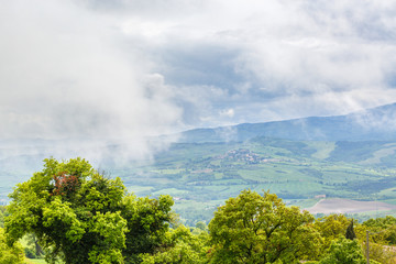 Low clouds in the valley of farmland