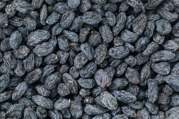 Black Raisin texture, popular dried fruit. Dried grapes.