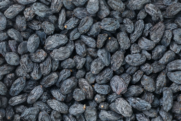 Black Raisin texture, popular dried fruit. Dried grapes.