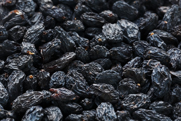 Black Raisin texture, popular dried fruit. Dried grapes.