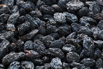 Black Raisin texture, popular dried fruit. Dried grapes.