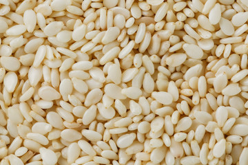 White sesame seeds background. Useful seeds for cooking
