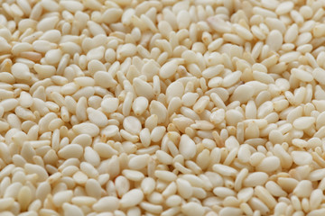 White sesame seeds background. Useful seeds for cooking