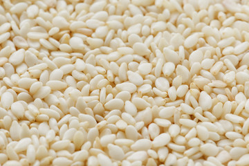White sesame seeds background. Useful seeds for cooking