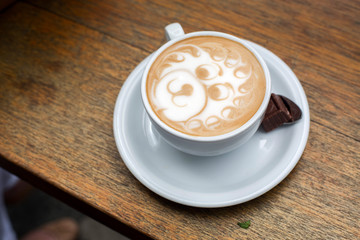 Latte Art Lion In Circular Plate With Chocolate