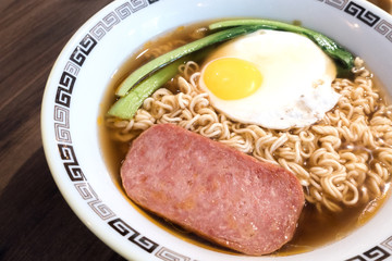 Hong Kong breakfast, sunny side up fried egg and luncheon meat on instant noodle