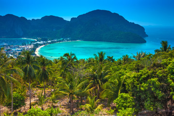 Fototapeta na wymiar Beautiful panoramic view over Tonsai and Dalum Beach. Green jungles and hot stones on the bright sun of tropical island and the mountains in Andaman Sea. Phi Phi Viewpoint, Krabi, Thailand.