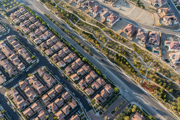 Aerial view towards modern suburban Porter Ranch homes and streets in the San Fernando Valley region of Los Angeles, California.