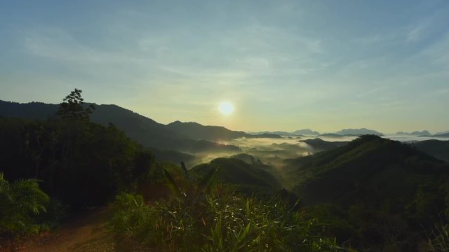 ta tun tone din Hill.Foggy morning view at sunrise. Scenic mountains, lush green complex