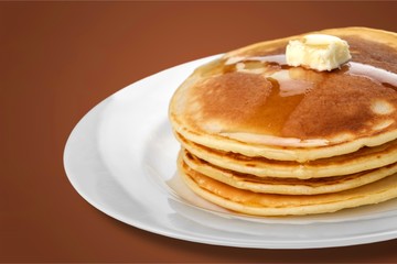 Stack of Small pancakes in syrup